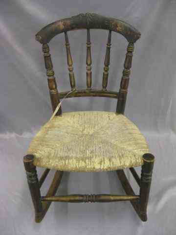 Appraisal: Early Child's Rocker original paint rush seat carved spindles