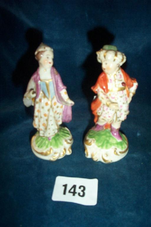 Appraisal: A pair of small early th century porcelain figures of