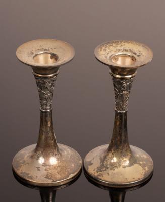 Appraisal: A pair silver trumpet shaped candlesticks engraved a band of