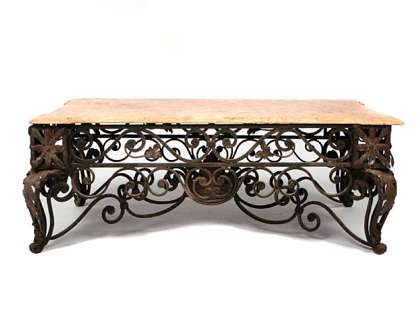 Appraisal: A wrought iron coffee table with a marble top height