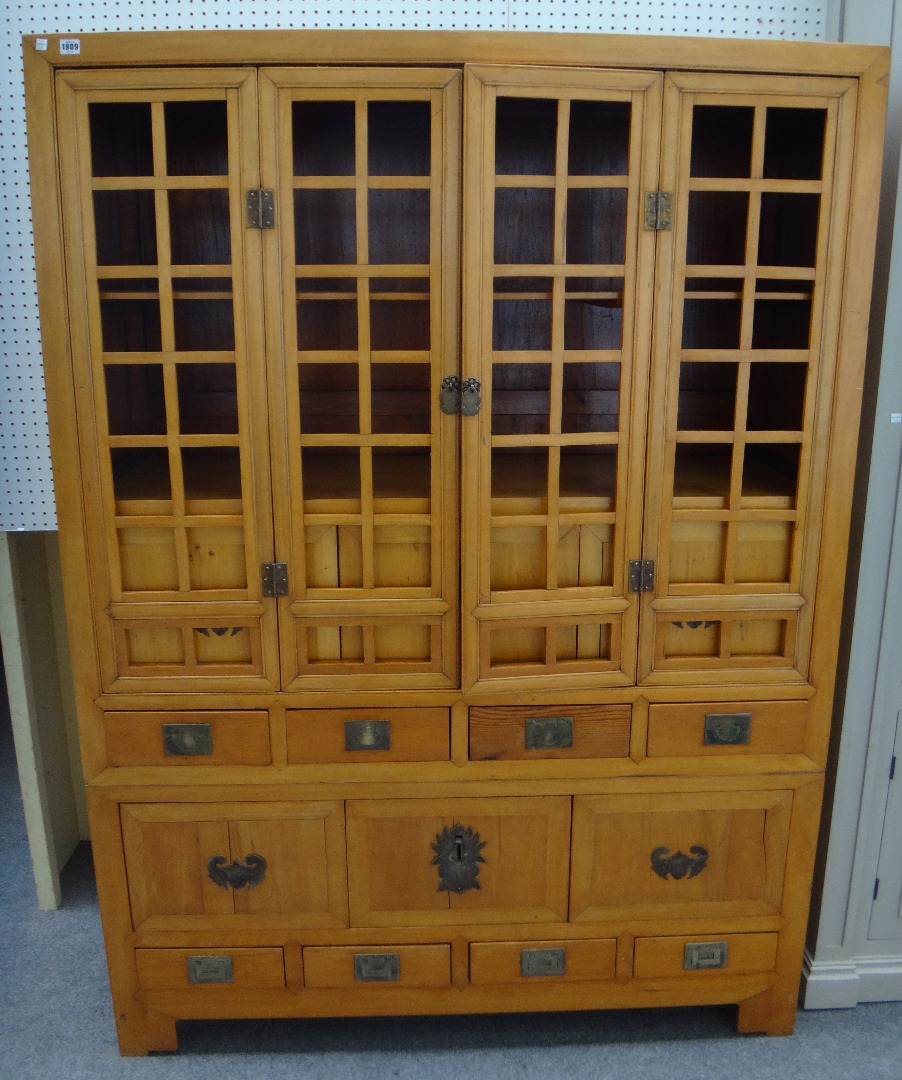 Appraisal: A th century Chinese peach wood food cupboard with four