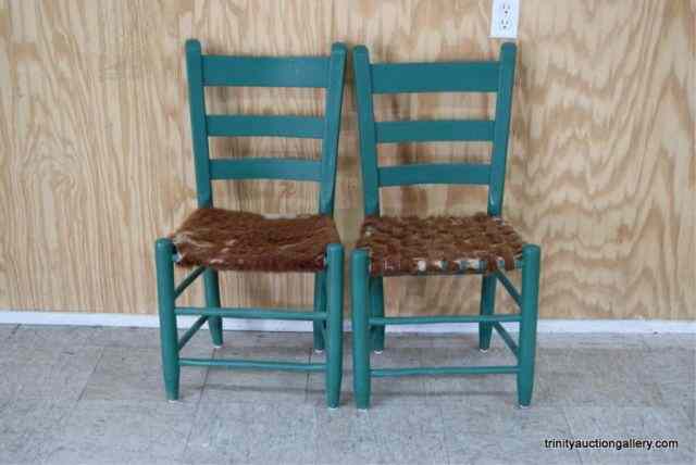 Appraisal: Vintage Slat Back Cowhide Seat ChairsFrom the estate is a