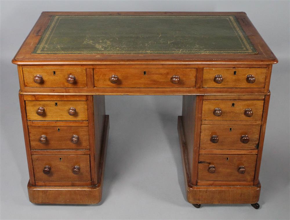 Appraisal: DIMINUTIVE CHERRY PARTNER'S DESK having a green leather and gilt