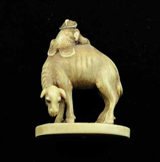 Appraisal: An unusual ivory netsuke carved as a man climbing upon