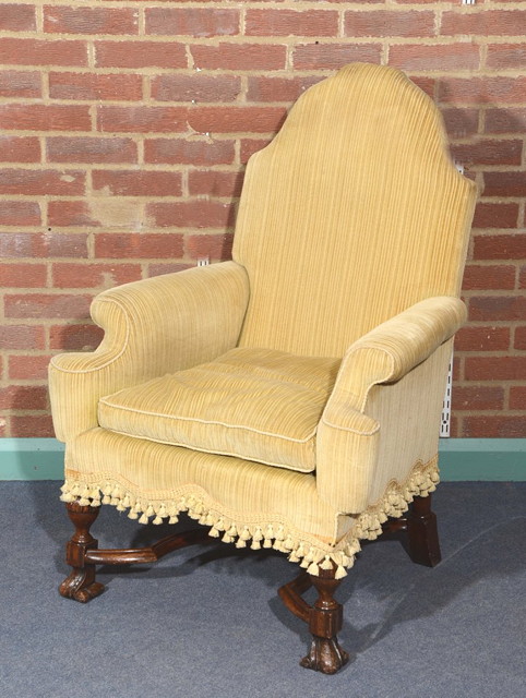 Appraisal: A TH CENTURY STYLE ARMCHAIR with high back loose cushion