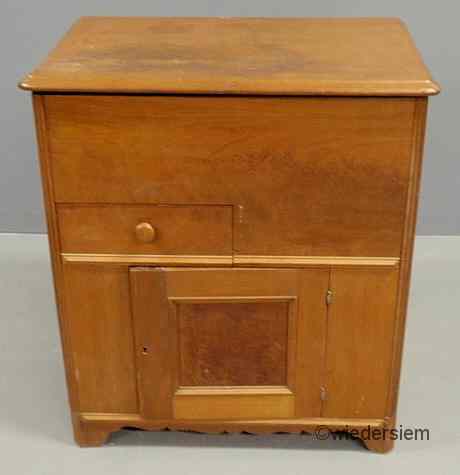 Appraisal: Walnut commode with a lift lid single drawer and door