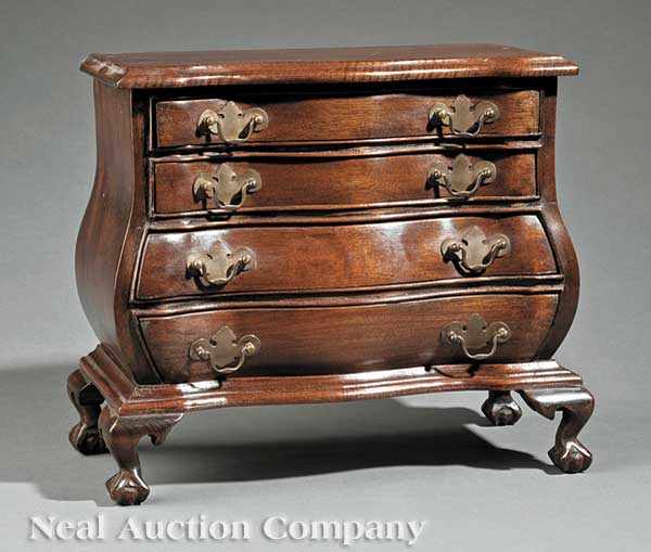 Appraisal: A Colonial Revival Miniature Carved Mahogany Bomb Chest c after