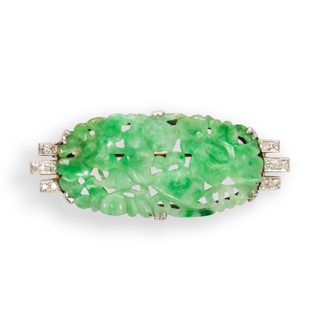 Appraisal: A JADE AND PLATINUM-TOPPED FOURTEEN KARAT GOLD BROOCH A jade