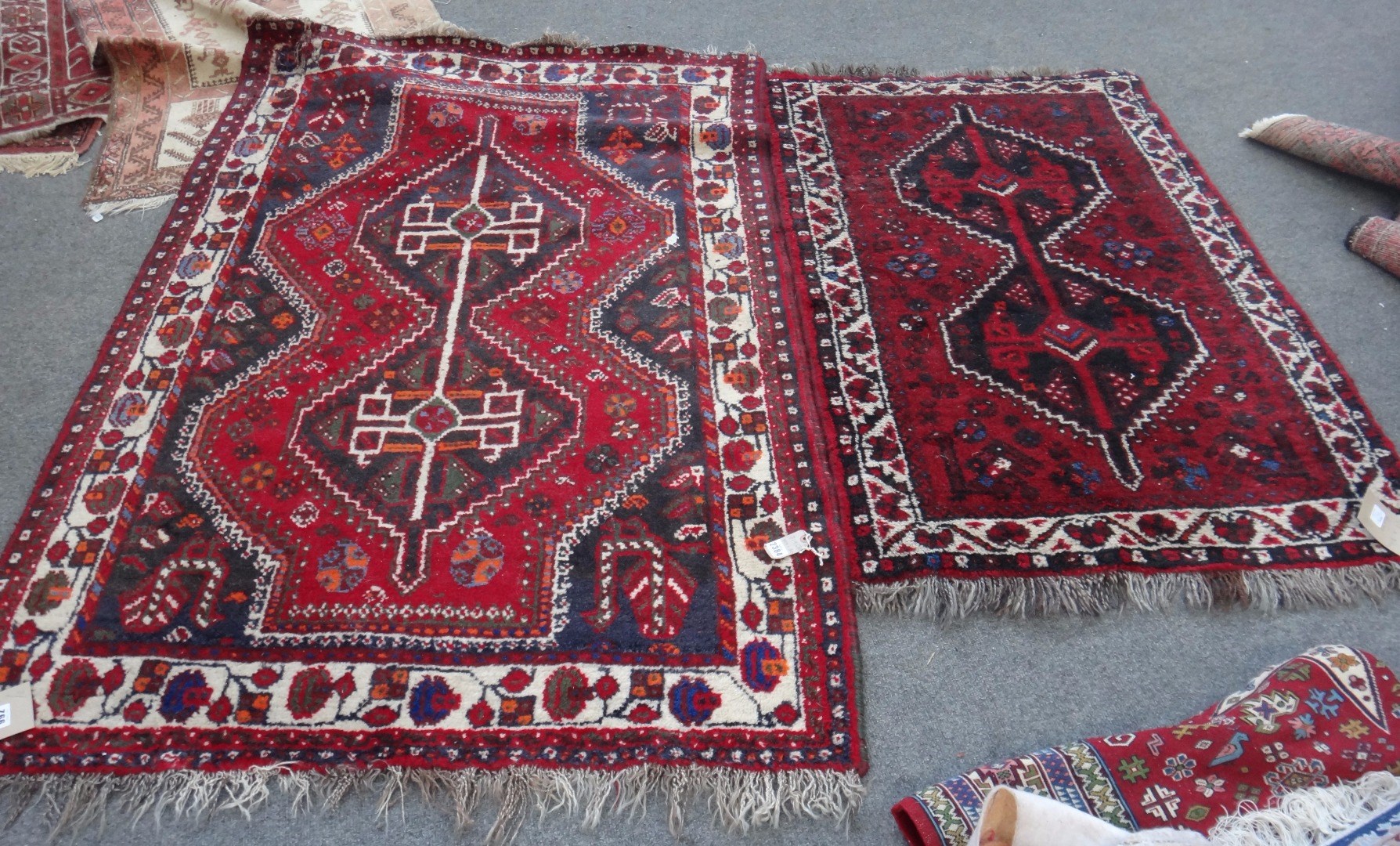 Appraisal: A Shiraz rug South Persian the madder field with a