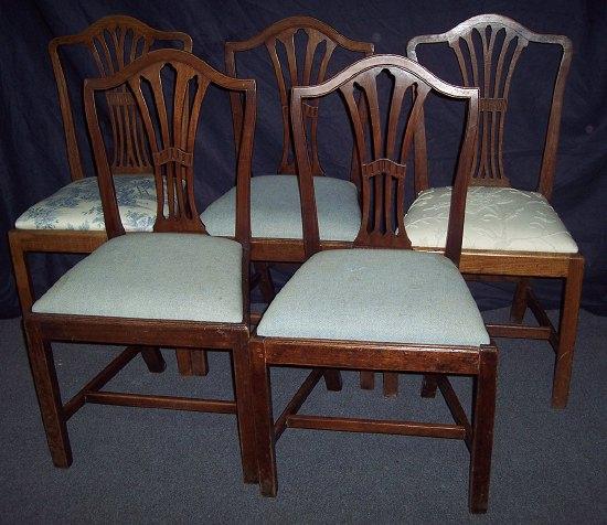 Appraisal: A set of three th Century mahogany dining chairs with