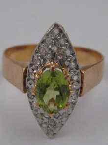 Appraisal: A French hallmarked carat gold marquise shaped peridot and diamond