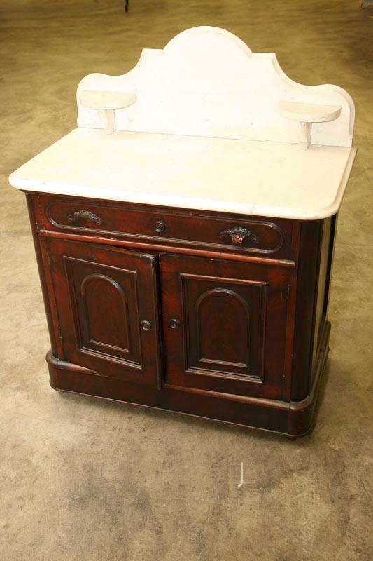 Appraisal: VICTORIAN COMMODE Walnut with white marble top with scalloped backsplash