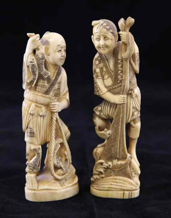 Appraisal: Two Japanese walrus ivory figures of fishermen each holding a