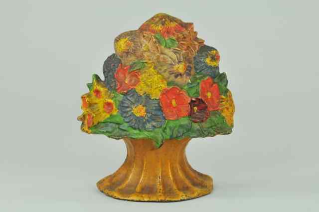 Appraisal: FLOWER BOUQUET DOORSTOP Modernistic design of colorful mixed flowers on