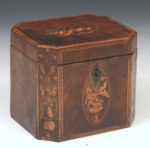 Appraisal: A RECTANGULAR GEORGIAN YEW WOOD TEA CADDY with canted corners