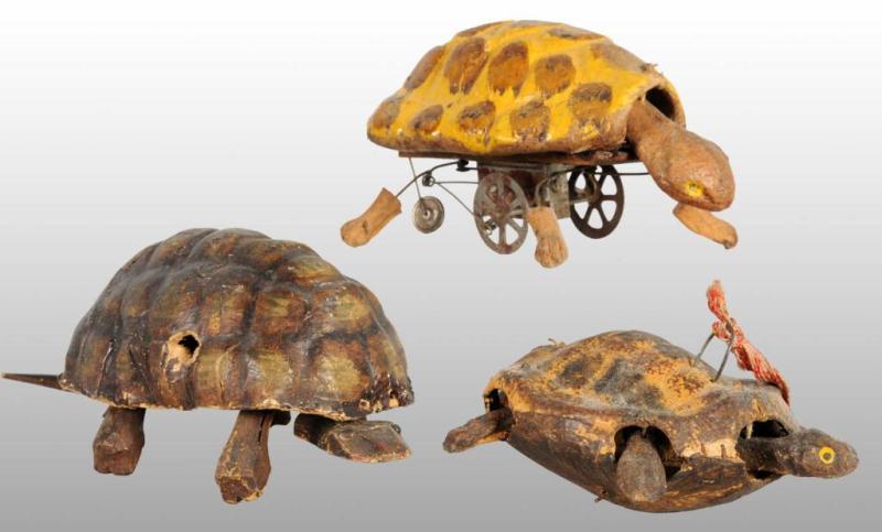 Appraisal: Lot of Early Papier Mache Turtle Toys Description German Includes