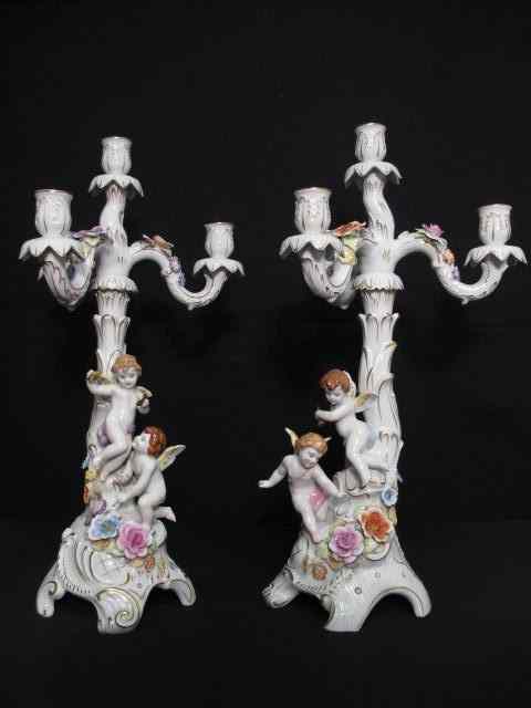 Appraisal: Pair of Meissen style three arm porcelain candlesticks Cupid figurals