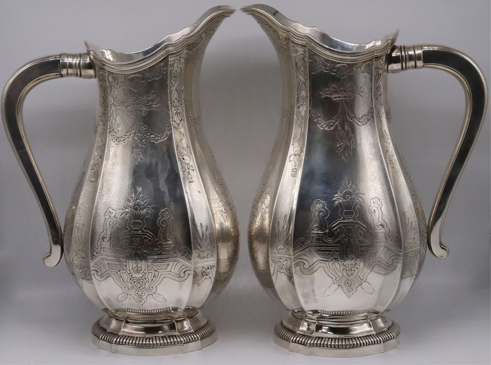 Appraisal: SILVER Matched Silver Water Jugs Includes a French silver water