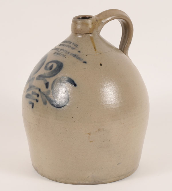 Appraisal: Decorated stoneware advertising jug ovoid shape free form cobalt decoration