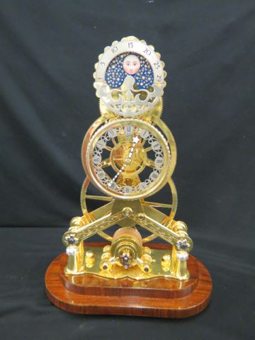 Appraisal: Skeleton Clock English Great Wheel design gold silver plated tall