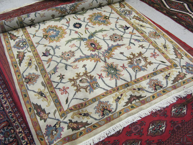 Appraisal: HAND KNOTTED ORIENTAL CARPET Indo-Persian having an overall floral decorated