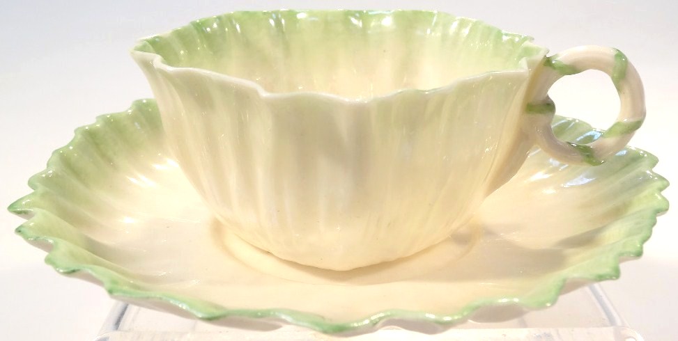 Appraisal: A Belleek Fine Parian china teacup and saucer each shell