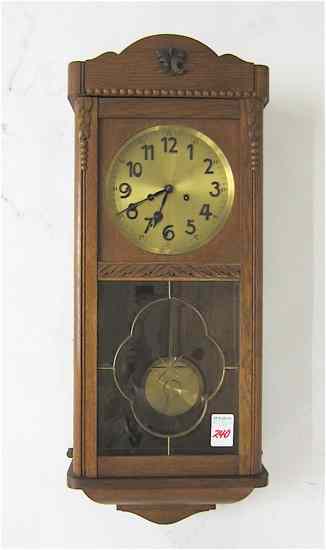 Appraisal: AN OAK BOX-CASE WALL CLOCK Gustav Becker Clock Workshops German