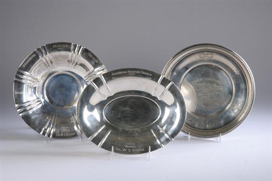 Appraisal: THREE SILVER SPORTING TROPHY DISHES One oval silver standard engraved