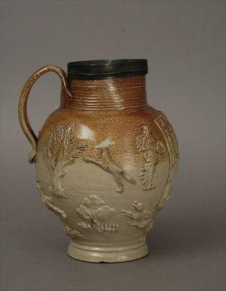 Appraisal: English Pewter-Mounted Salt-Glazed Stoneware Jug with Relief-Molded Decoration in in