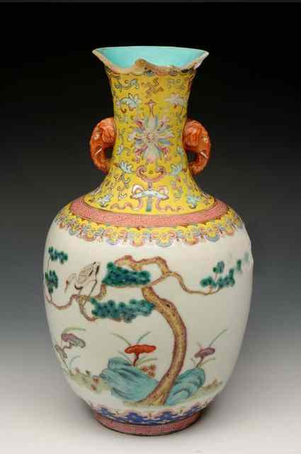 Appraisal: A CHINESE PORCELAIN OVIFORM TWO ELEPHANT HANDLE VASE decorated crane