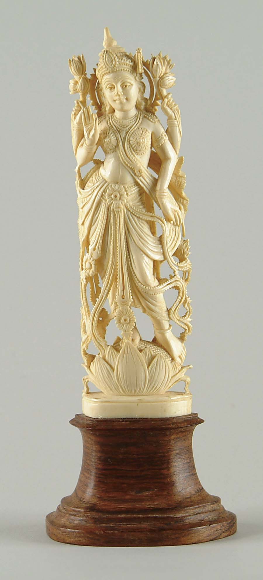 Appraisal: CARVED IVORY GODDESS Intricately carved ivory figure of a woman