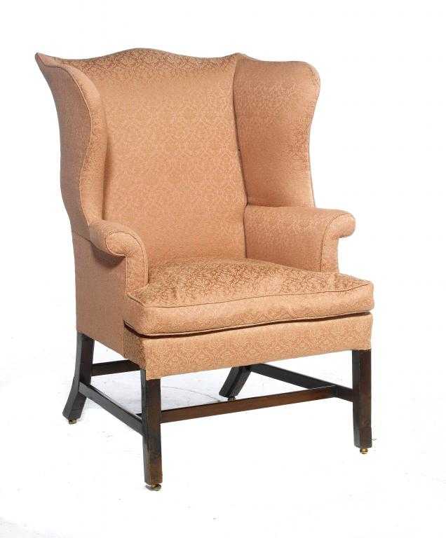 Appraisal: A GEORGE III MAHOGANY ARMCHAIR with wing back on chamfered