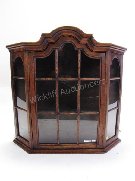 Appraisal: An antique wooden curio cabinet wall mount with glass door