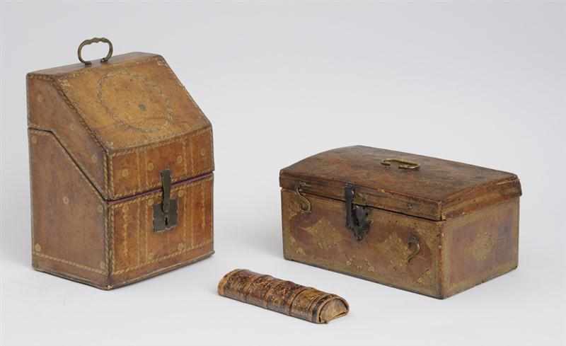 Appraisal: THREE GILT-TOOLED LEATHER BOXES The one with sloping hinged lid