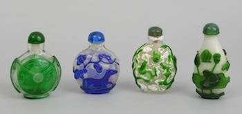 Appraisal: A Group of Chinese Peking Glass Snuff Bottles Containing a