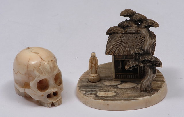 Appraisal: A JAPANESE IVORY NETSUKE in the form of a skull