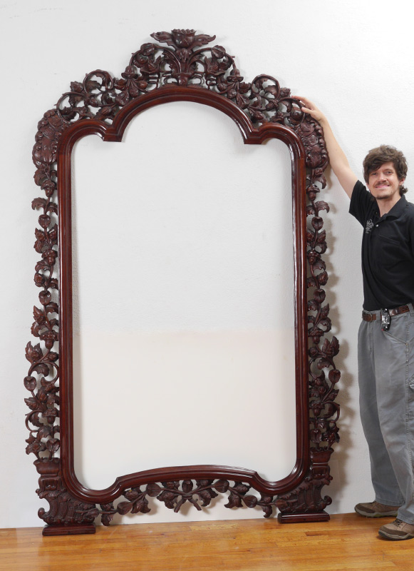 Appraisal: PALATIAL HEAVILY CARVED MIRROR FRAME Pierced carved with foliate and