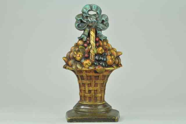 Appraisal: a FRUIT BASKET ON BASE DOORSTOP ''cJo'' cast iron depicts