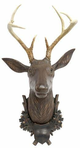 Appraisal: Black Forest carved wood stag's head trophy mount the plaque