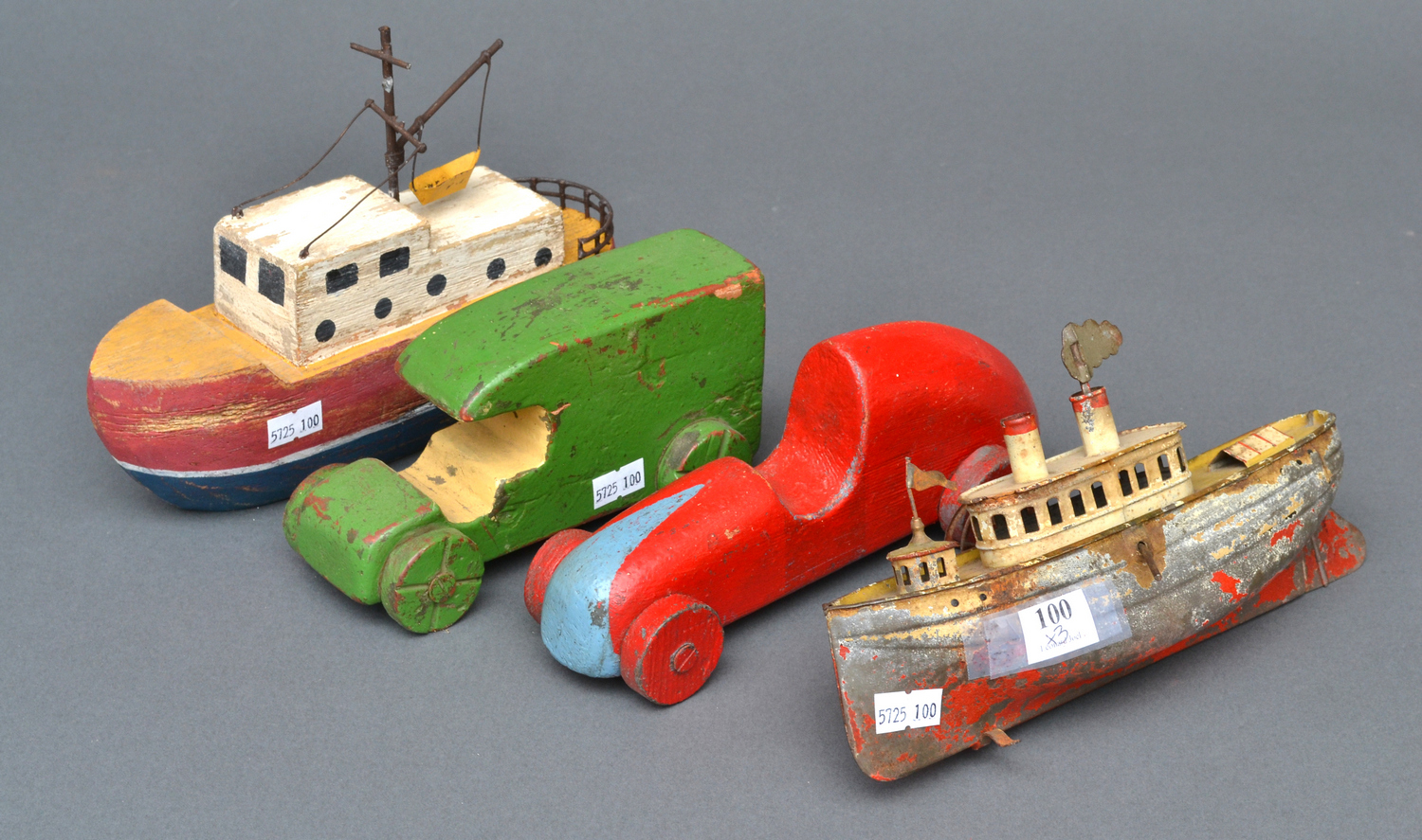 Appraisal: FOUR RUSTIC VINTAGE TOYS INCLUDING A PAINTED WOODEN LORRY A