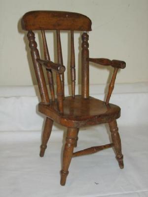 Appraisal: A VICTORIAN STAINED BEECH MINIATURE WINDSOR CHAIR of spindle back