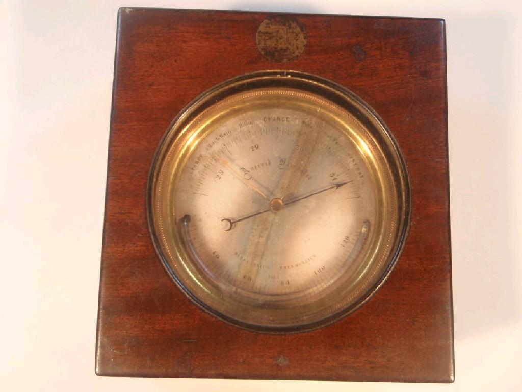 Appraisal: A Victorian brass cased aneroid barometer with a silvered cm