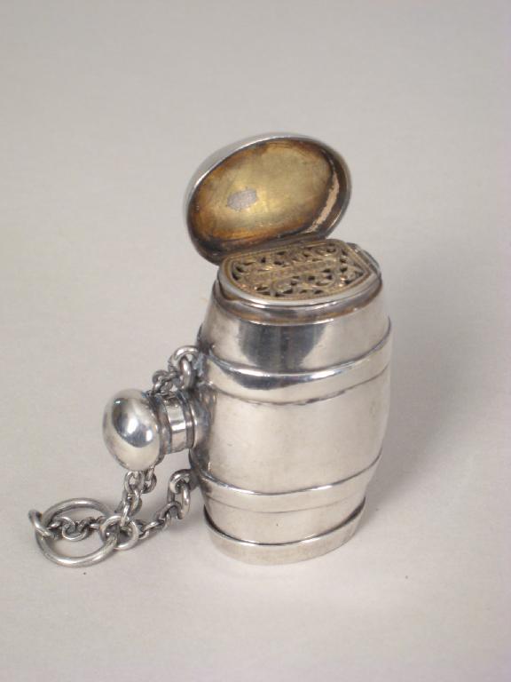 Appraisal: A combined Vinaigrette and Scent Bottle in the form of