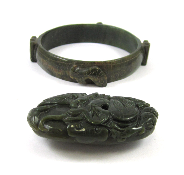 Appraisal: TWO DARK GREEN HARDSTONE ITEMS including an oval shaped hardstone