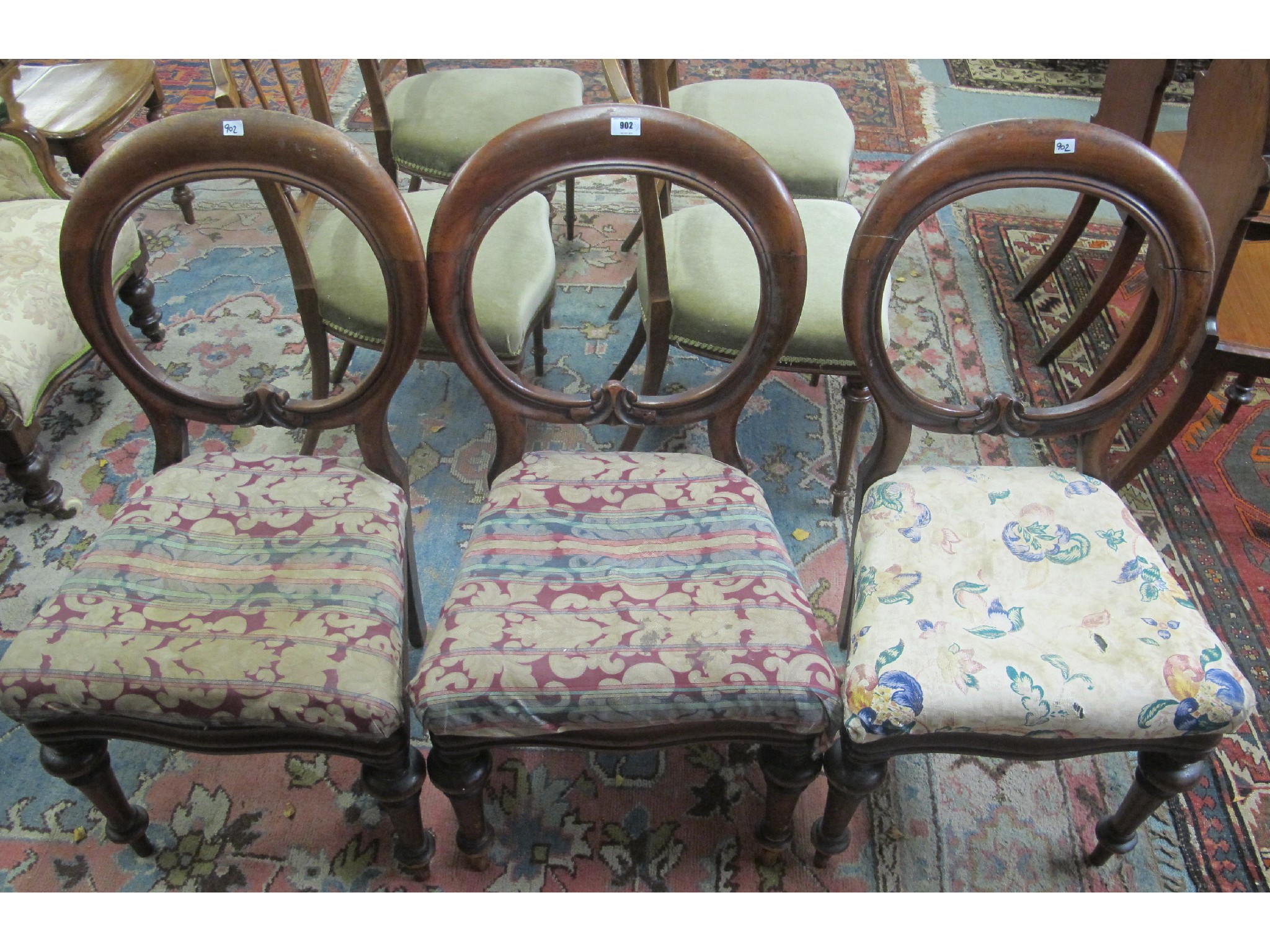 Appraisal: Three matching Victorian balloon back dining chairs