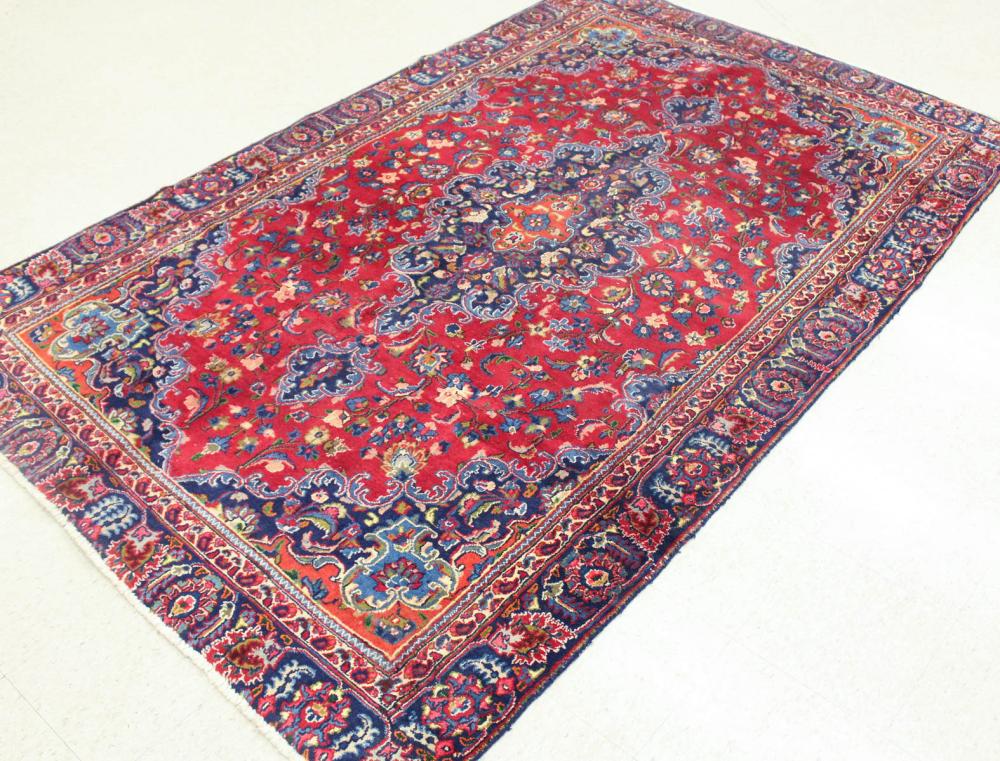 Appraisal: HAND KNOTTED PERSIAN CARPET floral and central floral medallion design