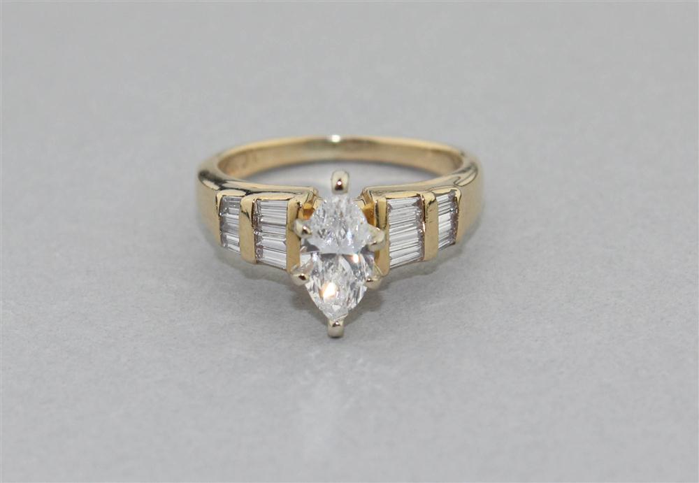 Appraisal: MARQUISE DIAMOND FLANKED BY DIAMOND BAGUETTES IN YELLOW GOLD the