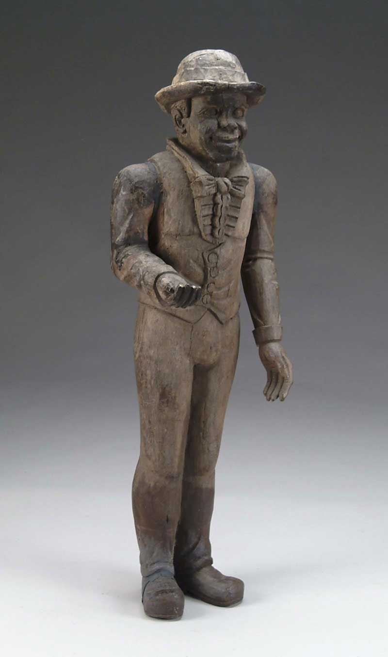 Appraisal: FOLK ART CARVED FIGURE OF A MAN The man wears