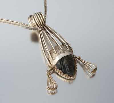 Appraisal: An Oversized Mexican Sterling Silver and Harstone Pendant Designed as