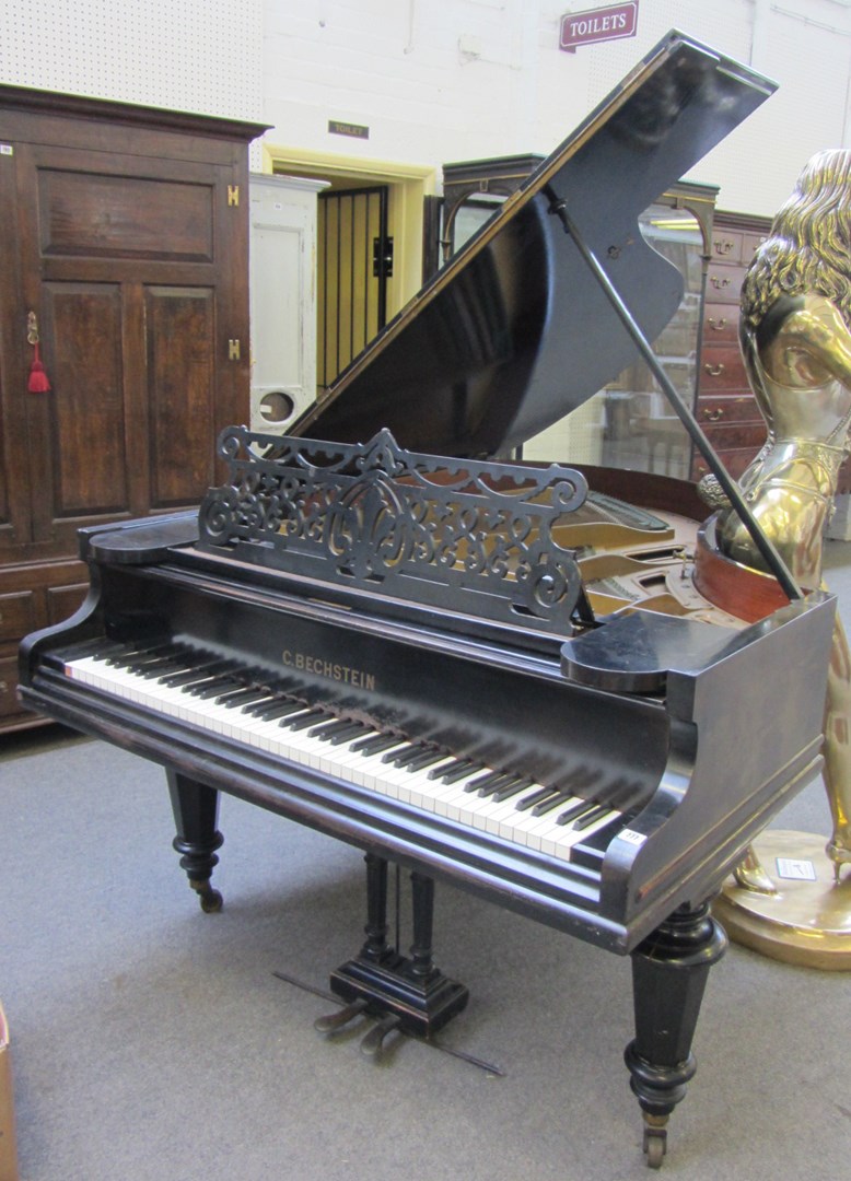 Appraisal: A C Bechstein Berlin iron-framed overstrung ebonised grand piano on